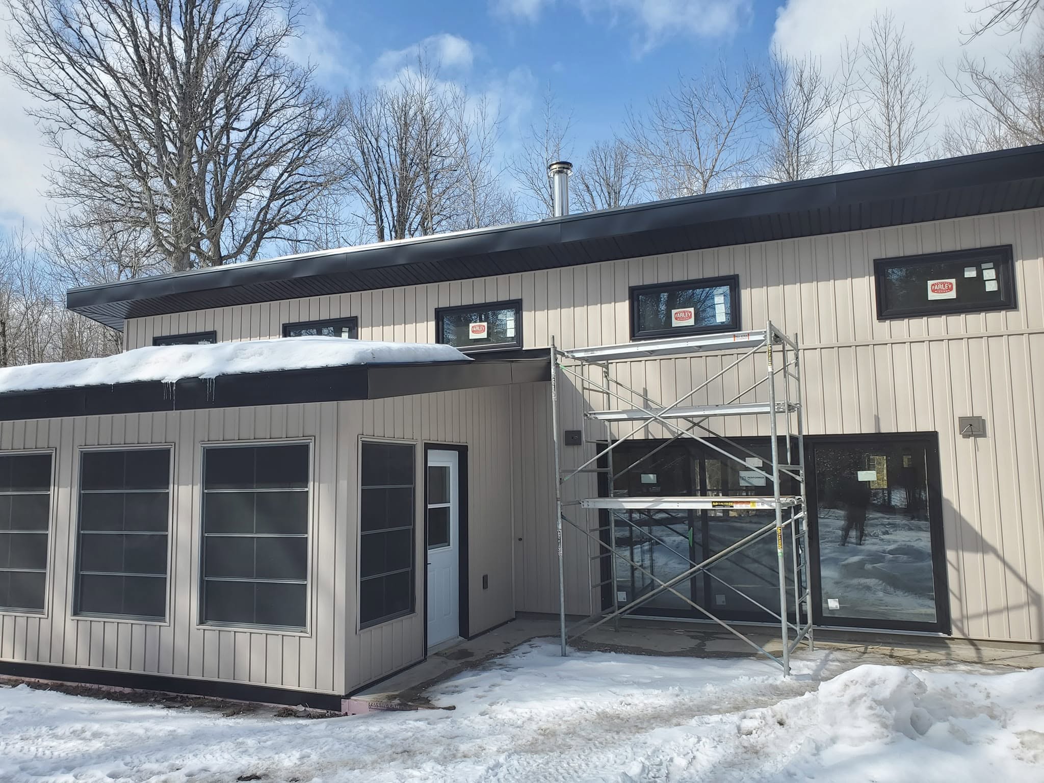 Cottage window and door installation on a winter project