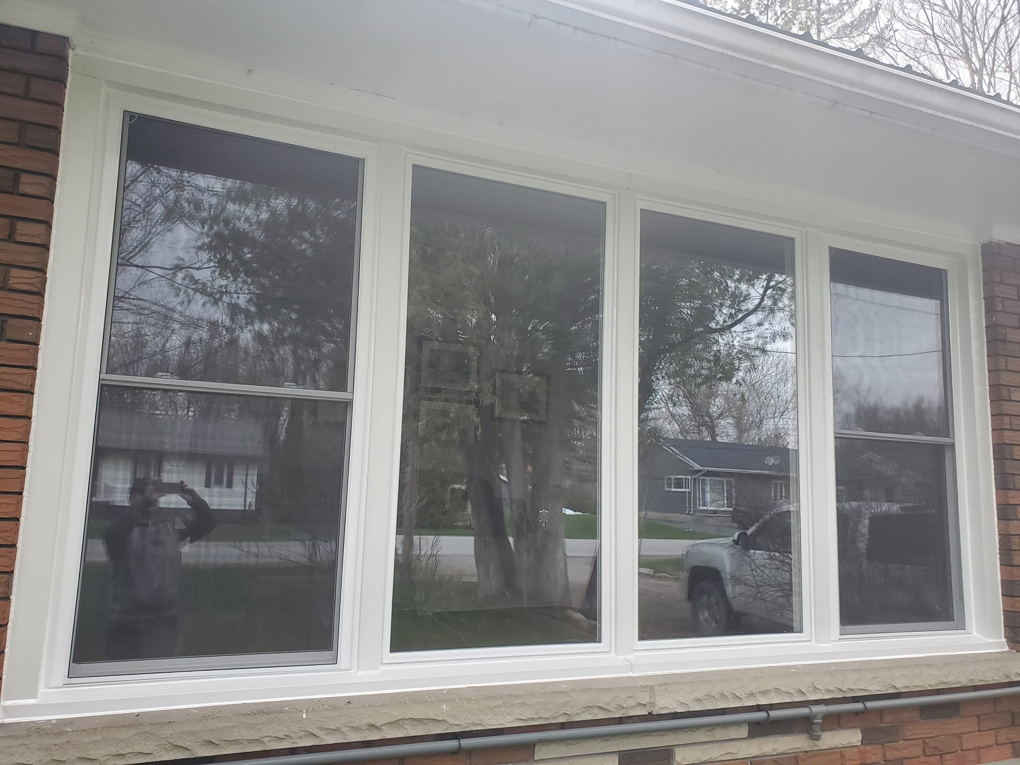 Close view of a completed multi-panel replacement window installation